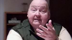 jon in green hand out